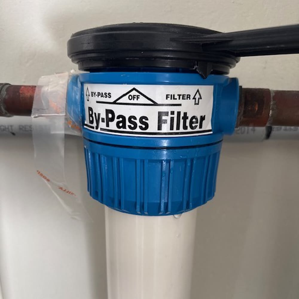 Bypass filter housing on copper piping.