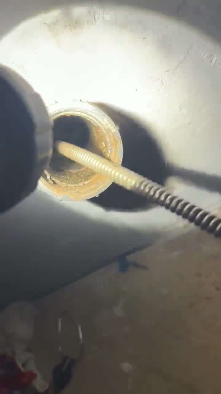 Feeding a drain cable through a wall cleanout, live job footage.