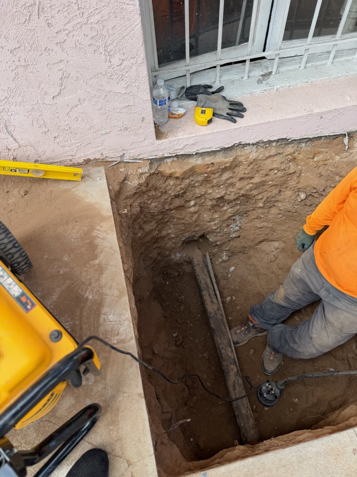 Working chest deep in a hand dug pit on a commercial hydro jetting job.