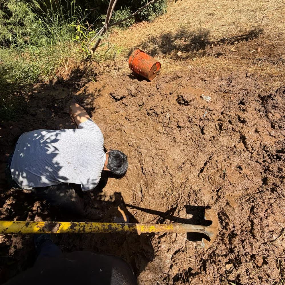 Excavating a leaking water service line.