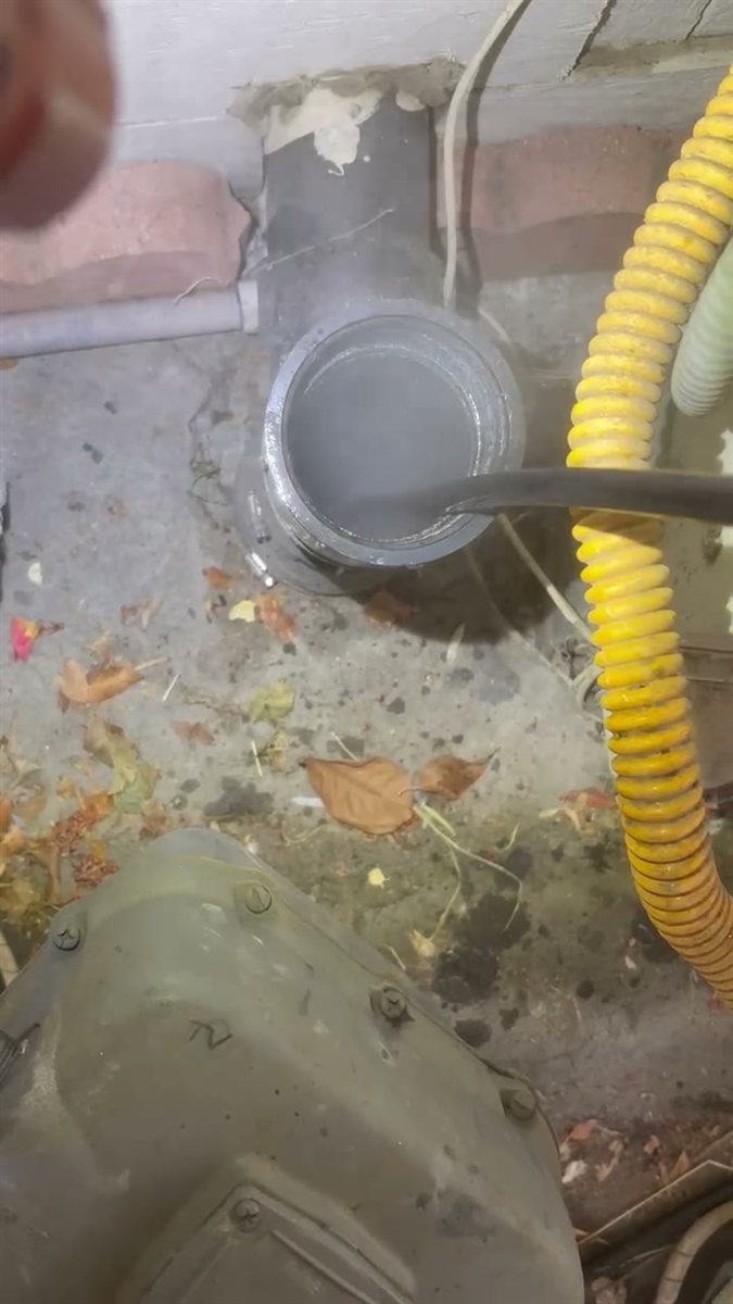 Hydro jetting a clogged drain line.