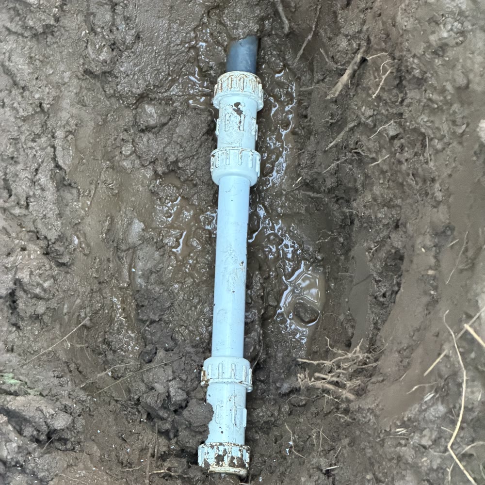 New PVC repair section on a water service line.
