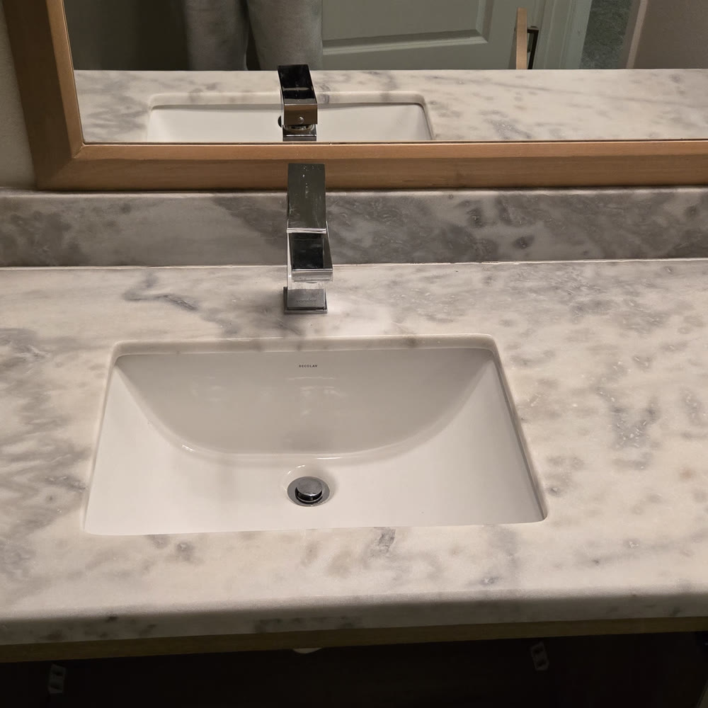 New chrome bathroom faucet installed on a vanity.