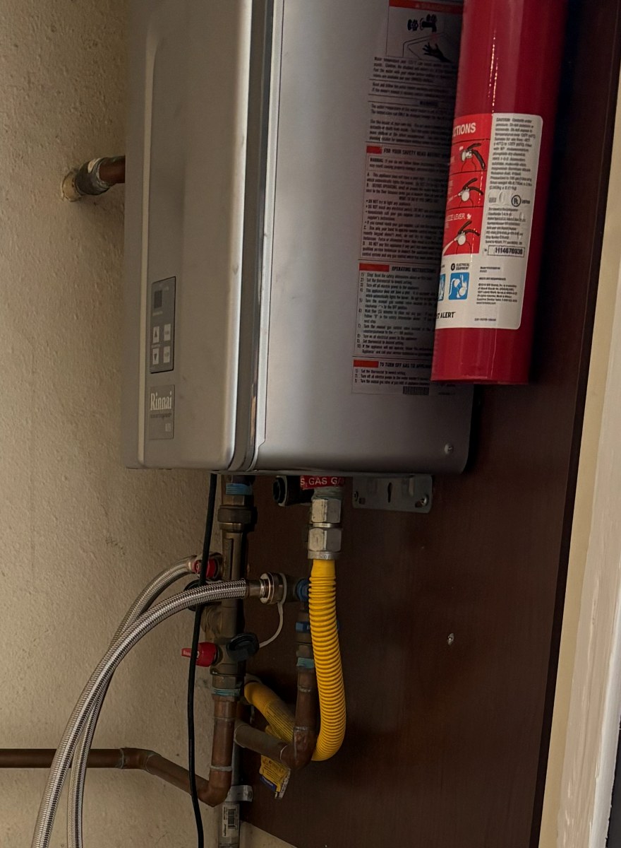 Tankless water heater being descaled.