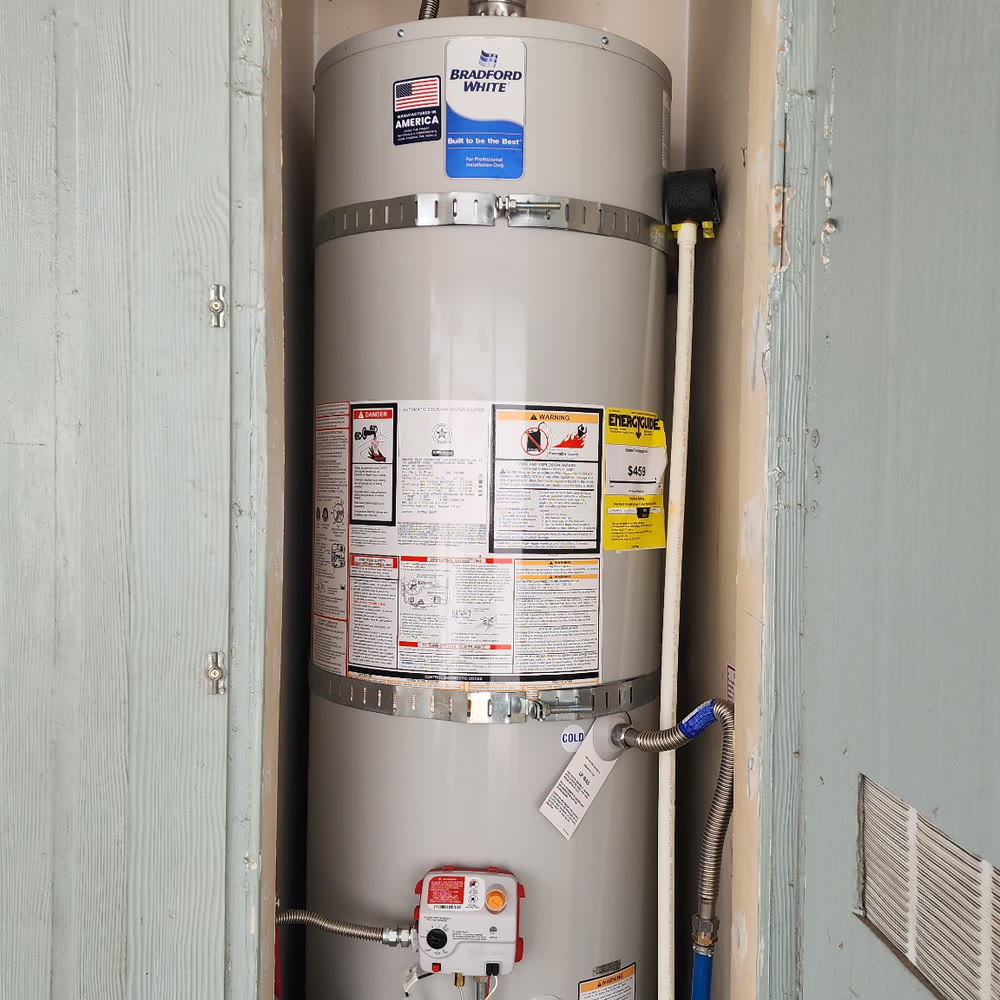 New gas water heater in an exterior closet.